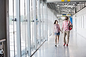 Full-length of couple walking in covered passage