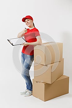 Full length of delivery woman in red cap, t-shirt isolated on white background. Female courier holding clipboard with