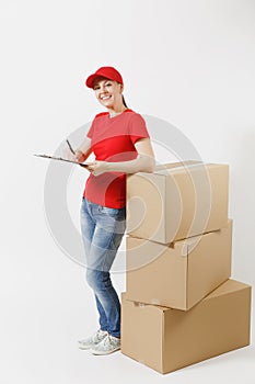 Full length of delivery woman in red cap, t-shirt isolated on white background. Female courier holding clipboard with