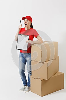 Full length of delivery woman in red cap, t-shirt isolated on white background. Female courier holding clipboard with