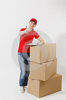 Full length of delivery woman in red cap, t-shirt isolated on white background. Female courier holding clipboard with