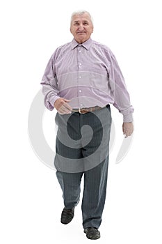 Full length gait of an old gray-haired man on a white background