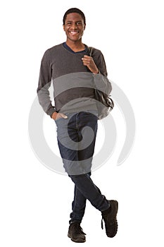 Full length handsome young black man smiling with bag against isolated white background