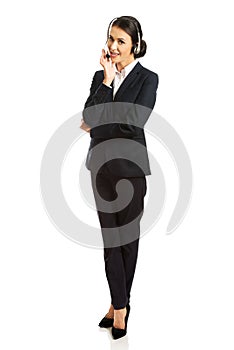 Full length happy phone operator in headset