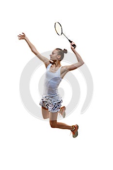 Full-length image of motivated athlete in motion, young girl, badminton player hitting shuttlecock in jump isolated over