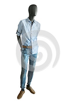 Full length male mannequin dressed in shirts and jeans.