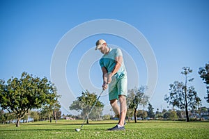 full length man playing golf game on green grass, sport