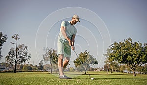 full length man playing golf game on green grass, sport