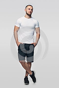 Full length man standing casually looking to side