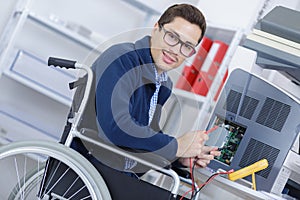 Full length manual worker in wheelchair