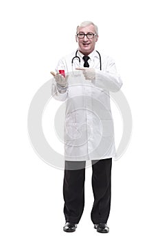 full-length. mature doctor with a laboratory flask in his hands .