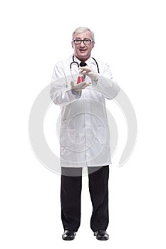 full-length. mature doctor with a laboratory flask in his hands .