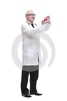 full-length. mature doctor with a laboratory flask in his hands .