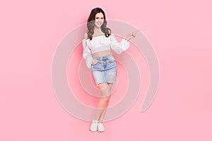 Full length photo of adorable charming female recommend you new modern clothes shop isolated on pink color background