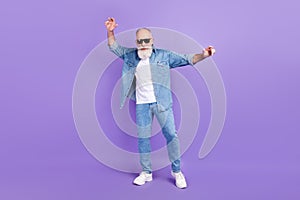 Full length photo of aged man happy positive smile have fun dance party isolated over purple color background