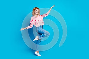Full length photo of attractive woman playful have fun look empty space dressed stylish pink clothes  on blue