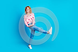 Full length photo of attractive woman playful have fun look empty space dressed stylish pink clothes isolated on blue