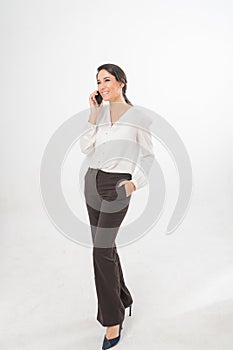 Full Length Photo of a Beautiful Brazilian Business Woman On The Phone