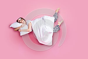 Full length photo of cheerful lady satisfied morning nap lying bed hug pillow covered blanket wear mask white t-shirt