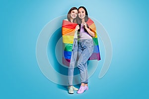 Full length photo of cute lesbians couple ladies celebrate parade show tolerance same sex marriages hugging hold gay