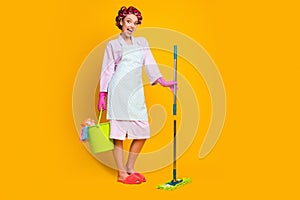 Full length photo of excited crazy girl hold mop bucket wear lilac bath robe gloves isolated shine color background