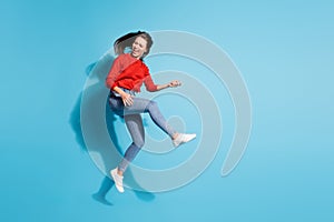 Full length photo of funky crazy lady jump flight play imaginary guitar musician  blue color background