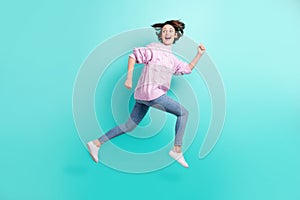 Full length photo of funky funny lady dressed purple pullover jumping running looking back empty space isolated teal