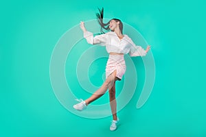 Full length photo of good mood energetic lady enjoy youth discotheque music isolated cyan color background