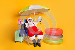 Full length photo of grey white hair bearded santa claus rest chill chaise-lounge show underwater diving gear wear red