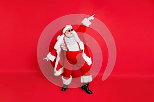 Full length photo of handsome old dabber fat funny santa claus in eyeglasses dance with his hand raised wearing style