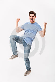 Full-length photo of happy man 30s in casual t-shirt and jeans r