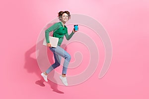 Full length photo of jumper girl running with morning latte cup coffee bring non brand wireless computer isolated on