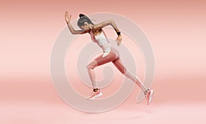 Full length photo of lady jump high up training marathon finish line wear sports suit isolated pink color background