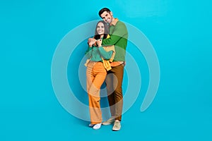 Full length photo of loving care two people cuddle comfy enjoy time together isolated on blue color background