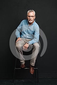 Full length photo of mature stylish man 60s with grey hair and b