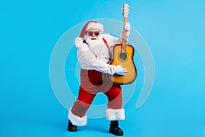 Full length photo of modern funky santa claus with big belly beard play guitar on x-mas christmas noel event wear