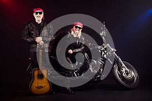 Full length photo of old two cool bikers man lady sit chopper rock festival play guitar famous popular metal band