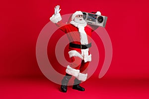 Full length photo of pensioner old man white beard raise hand hold retro radio carefree wear x-mas santa costume gloves