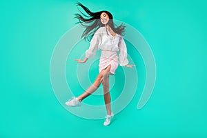 Full length photo of positive cheerful sweet lady dance discotheque active isolated cyan color background