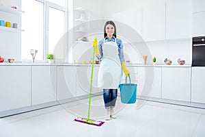 Full length photo of positive confident woman housewife hold bucket mop ready clean room floor disinfect covid-29