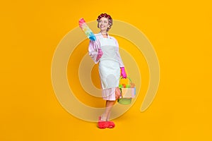 Full length photo of positive girl hold bucket duster wear bath robe gloves isolated shine color background