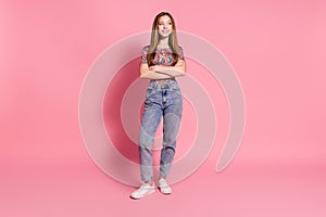 Full length photo of positive girl wear print t-shirt holding arms folded look at sale empty space isolated on pink