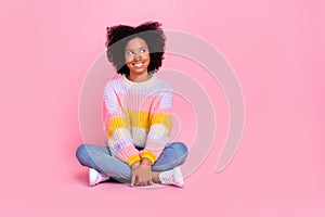 Full length photo of positive optimistic girl with perming coiffure wear knit sweater look empty space isolated on pink