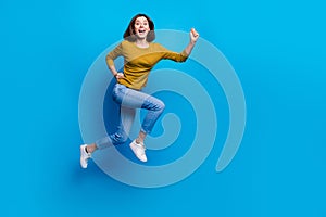 Full length photo of pretty cheerful lady dressed shirt jumping high running fast empty space isolated blue color