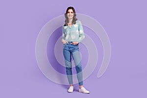 Full length photo of pretty cute lady dressed flower print cardigan smiling walking isolated violet color background