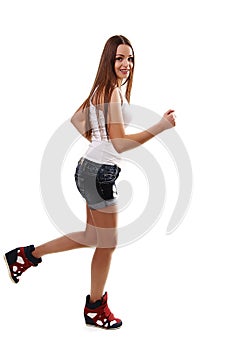 Full-length photo of running woman over white background