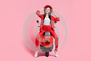 Full length photo of young girl happy positive smile dream look empty space wear sunhat trip motorbike isolated over