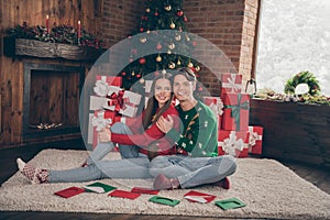 Full length photo of young lovely couple happy positive smile hug cuddle decoration christmas spirit indoors