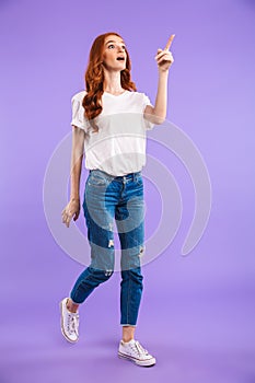 Full length portrait of an amazed young girl