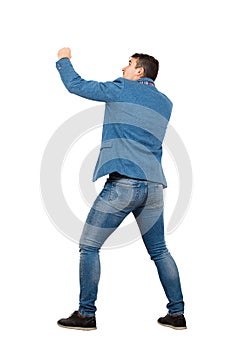 Full length portrait of angry businessman ready for battle standing in fighting position isolated over white background. People